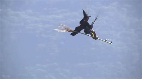 Massive flying witch with broom
